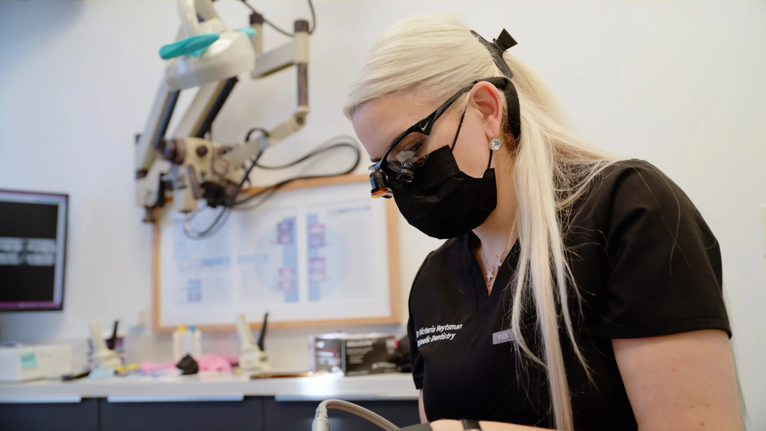 Dr Victoria Veytsman at microscope cosmetic dental video production