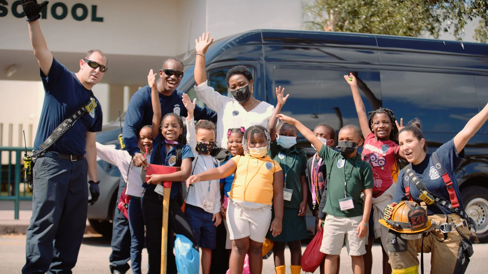 Ranger Technical Resources 9 Firefighters and Dillard Elementary students waving together at Career City 2022