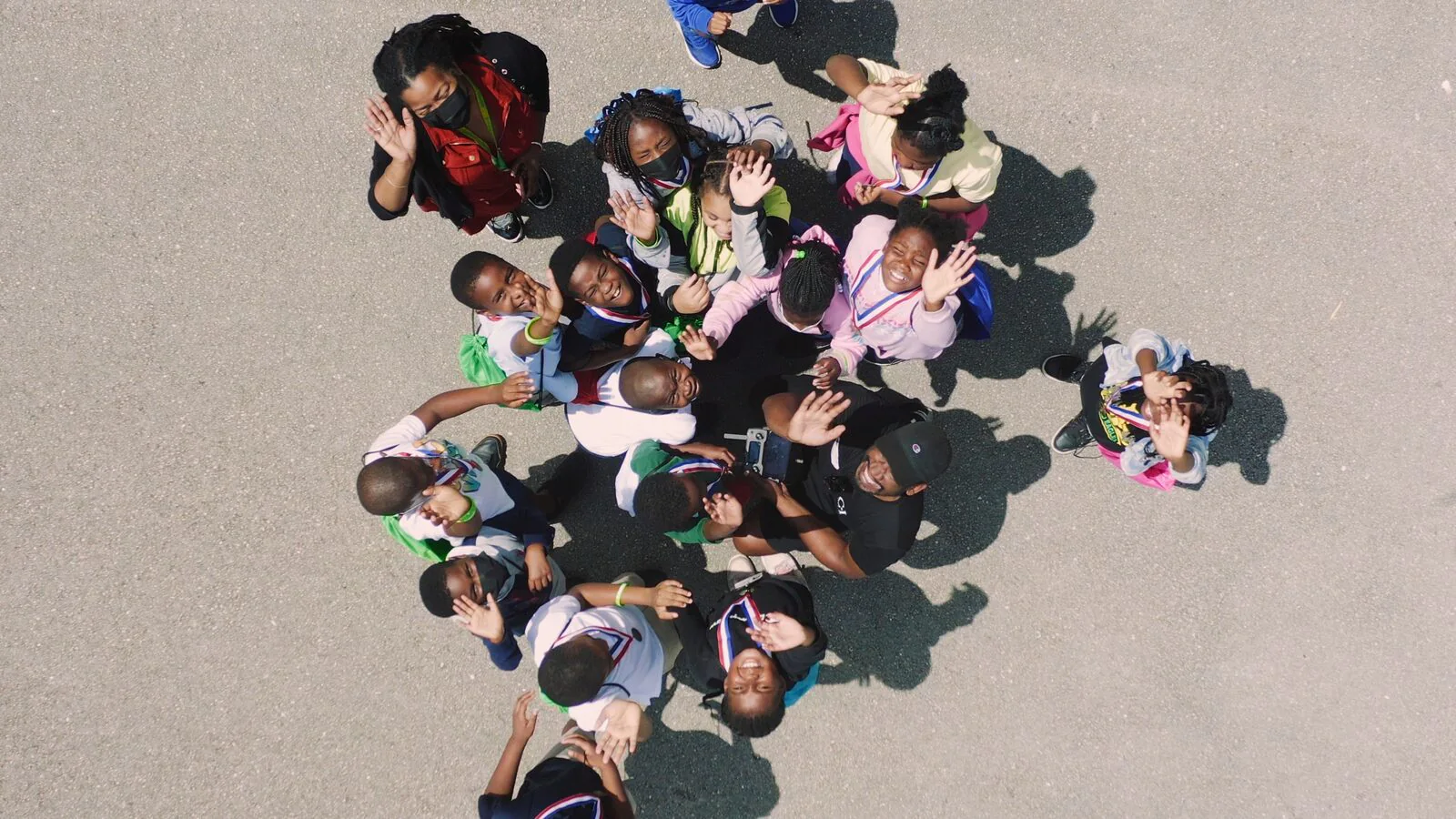 Ranger Technical Resources 11 Overhead view of Dillard Elementary students waving at Ranger Good Works Career City