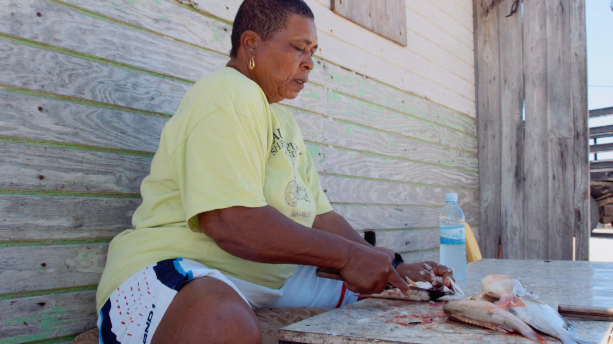 Marina Bland at Ragged Island 11 Ragged Island local cleaning the day's catch