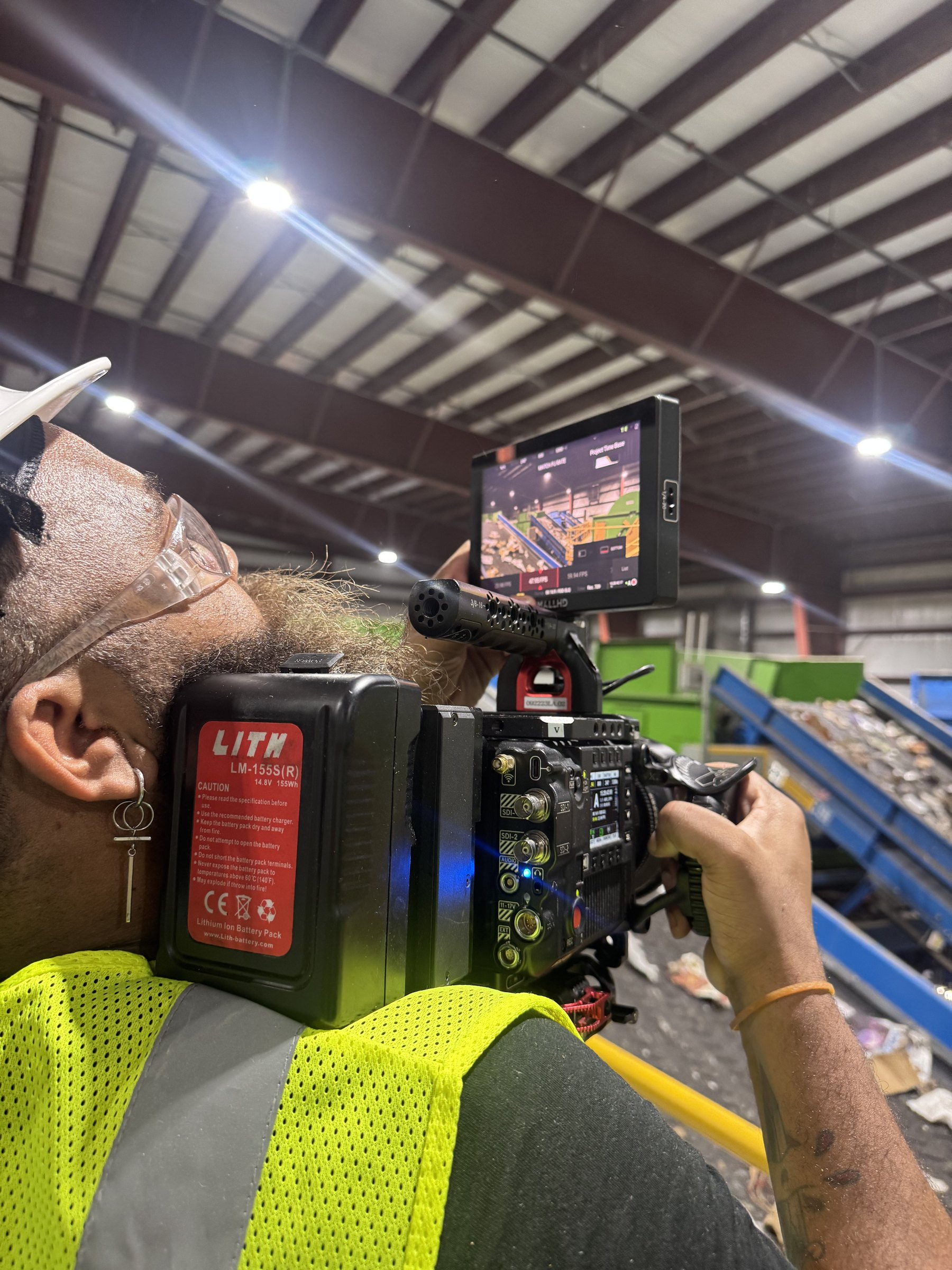 Conceptual Communications: Waste Management 28 C&I Studios camera operator filming b roll at the Waste Management recycling facility