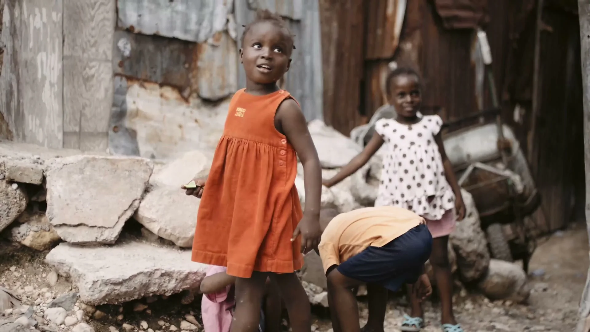 AIDS Healthcare Foundation 17 ahf haiti girl in orange dress