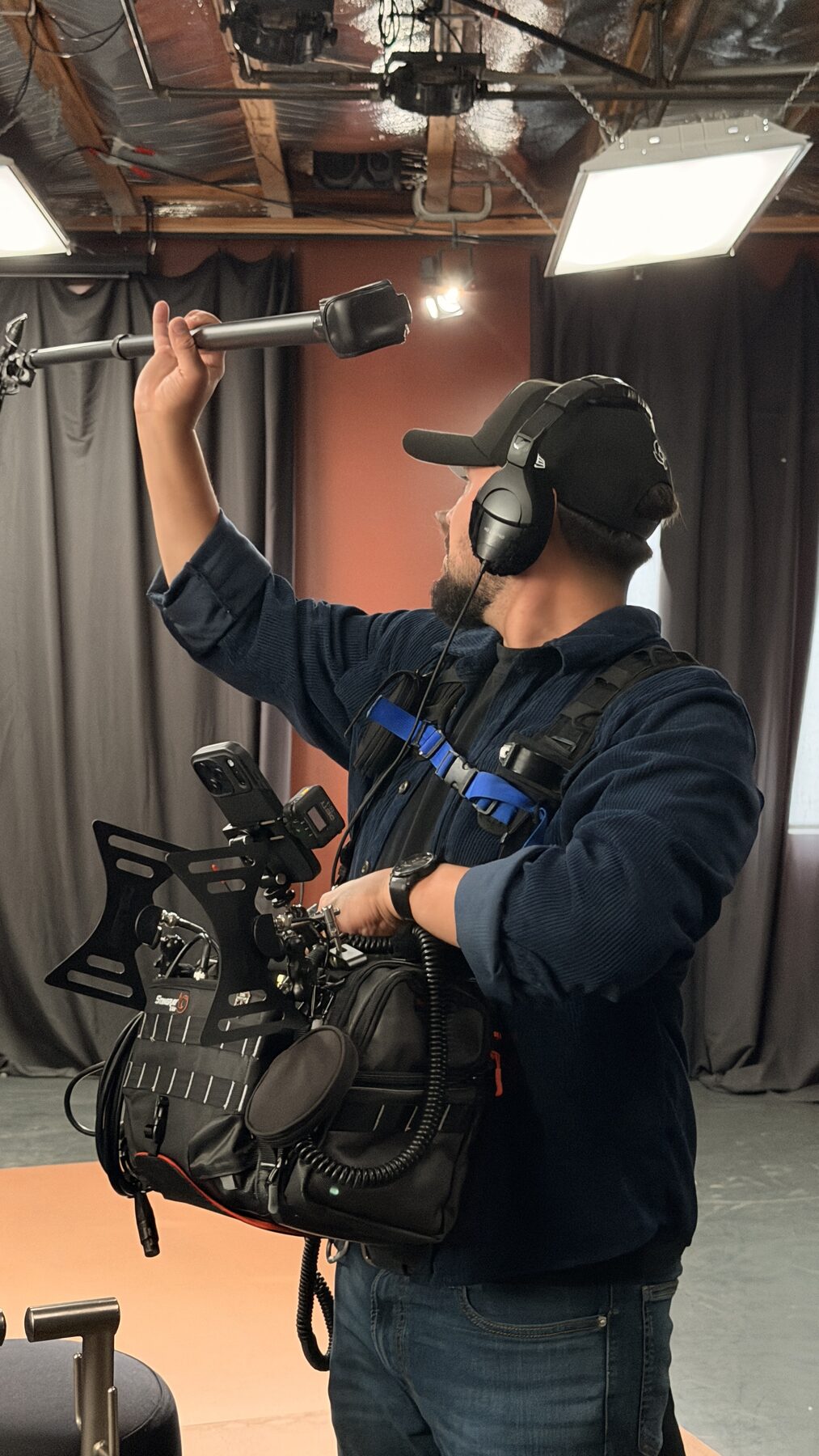 The Loudest Voice 11 Boom operator holding a microphone over the set on a Los Angeles shoot
