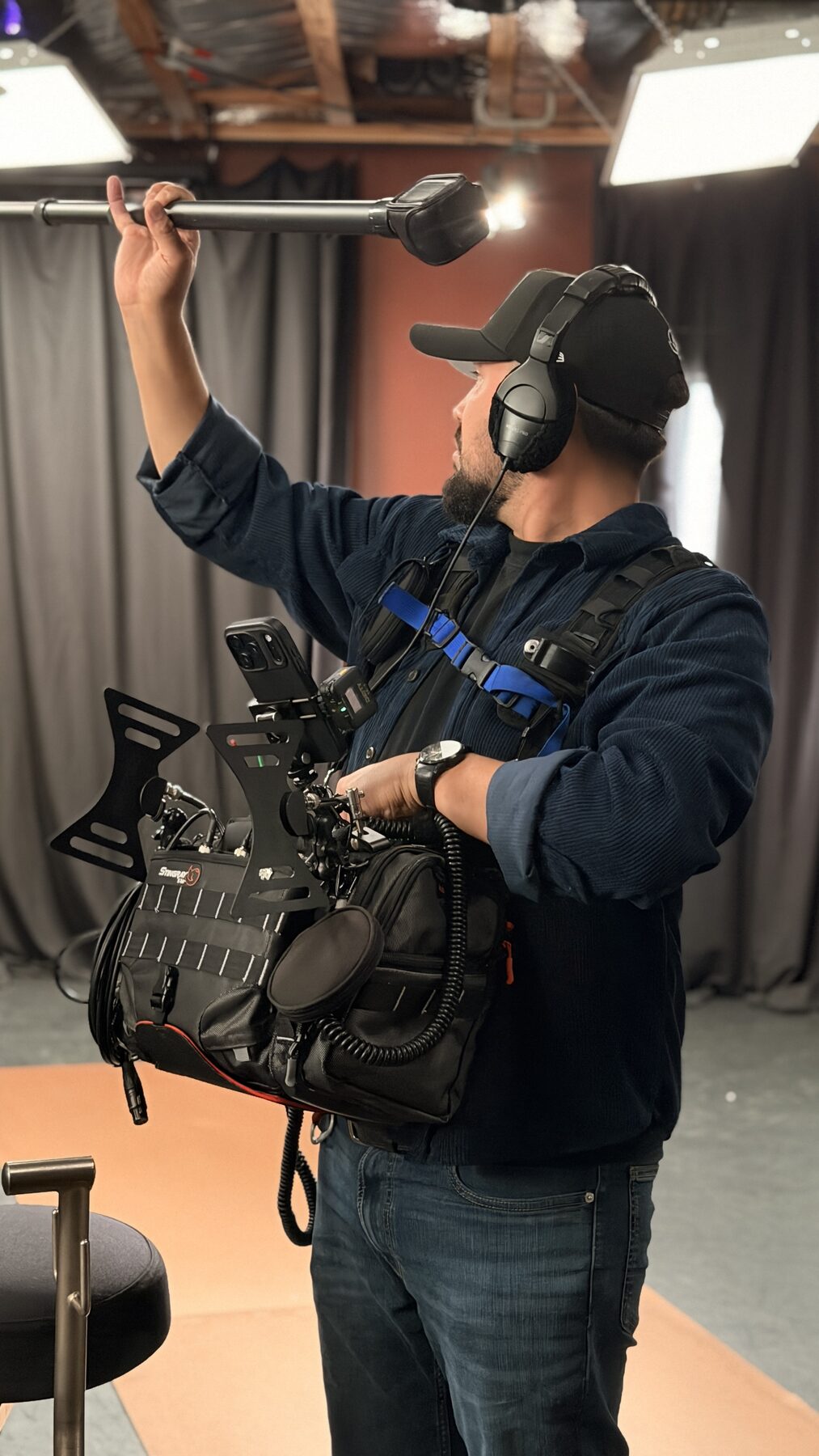 The Loudest Voice 2 Production sound mixer working from a bag rig on The Loudest Voice