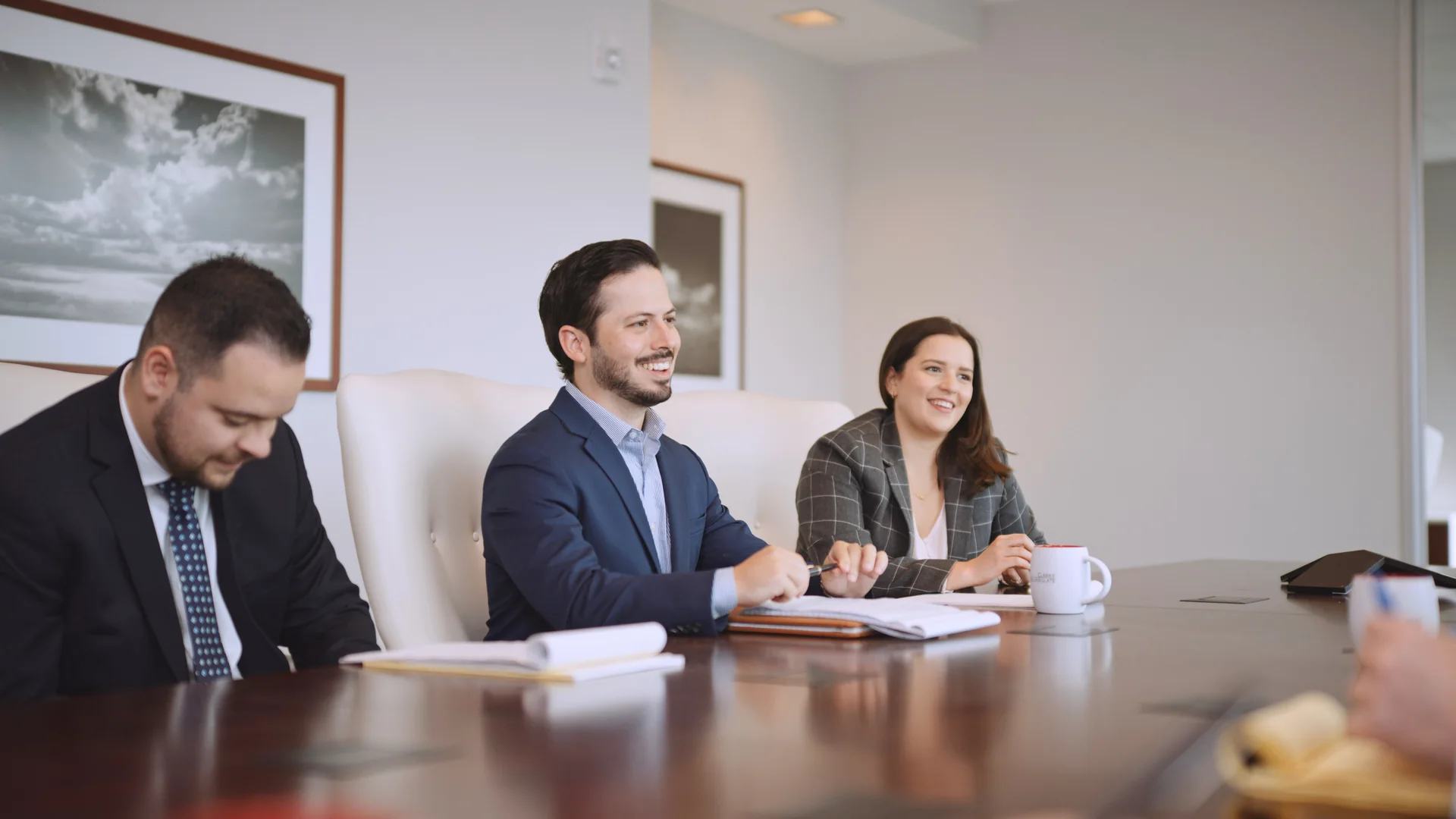 Corporate Video Production Cost. What You Actually Pay For 2 Leadership team filmed around a boardroom table on a corporate video shoot day