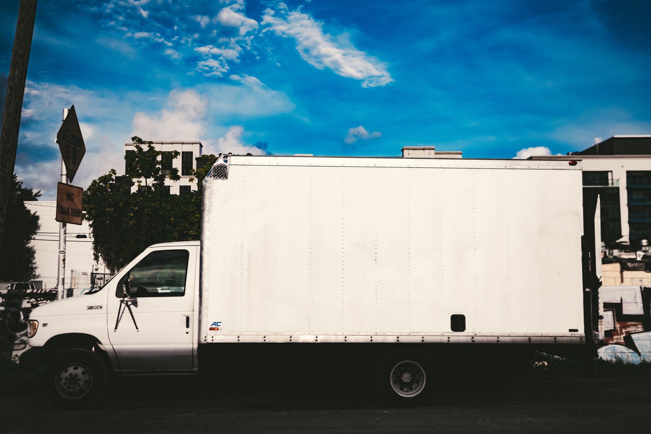 Gear 17 C&I Studios grip truck parked on location under a blue sky