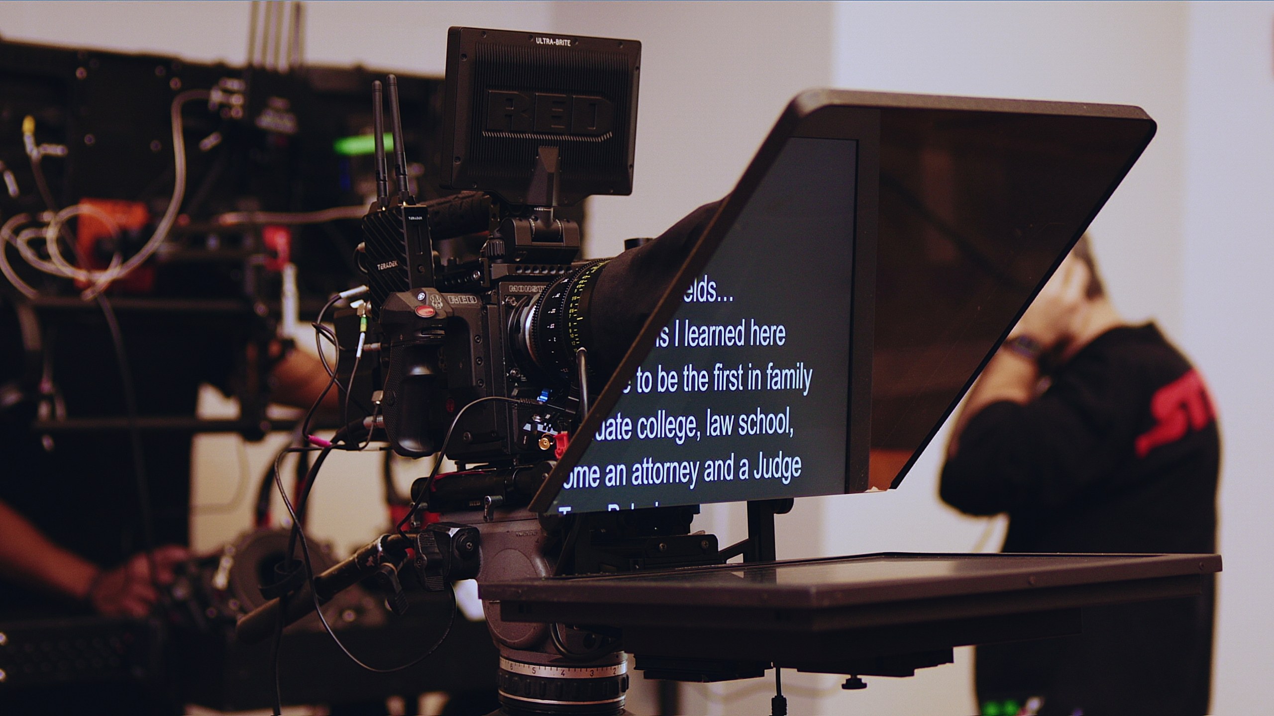 Gear 37 RED cinema camera rigged with a Prompter People teleprompter reading a script