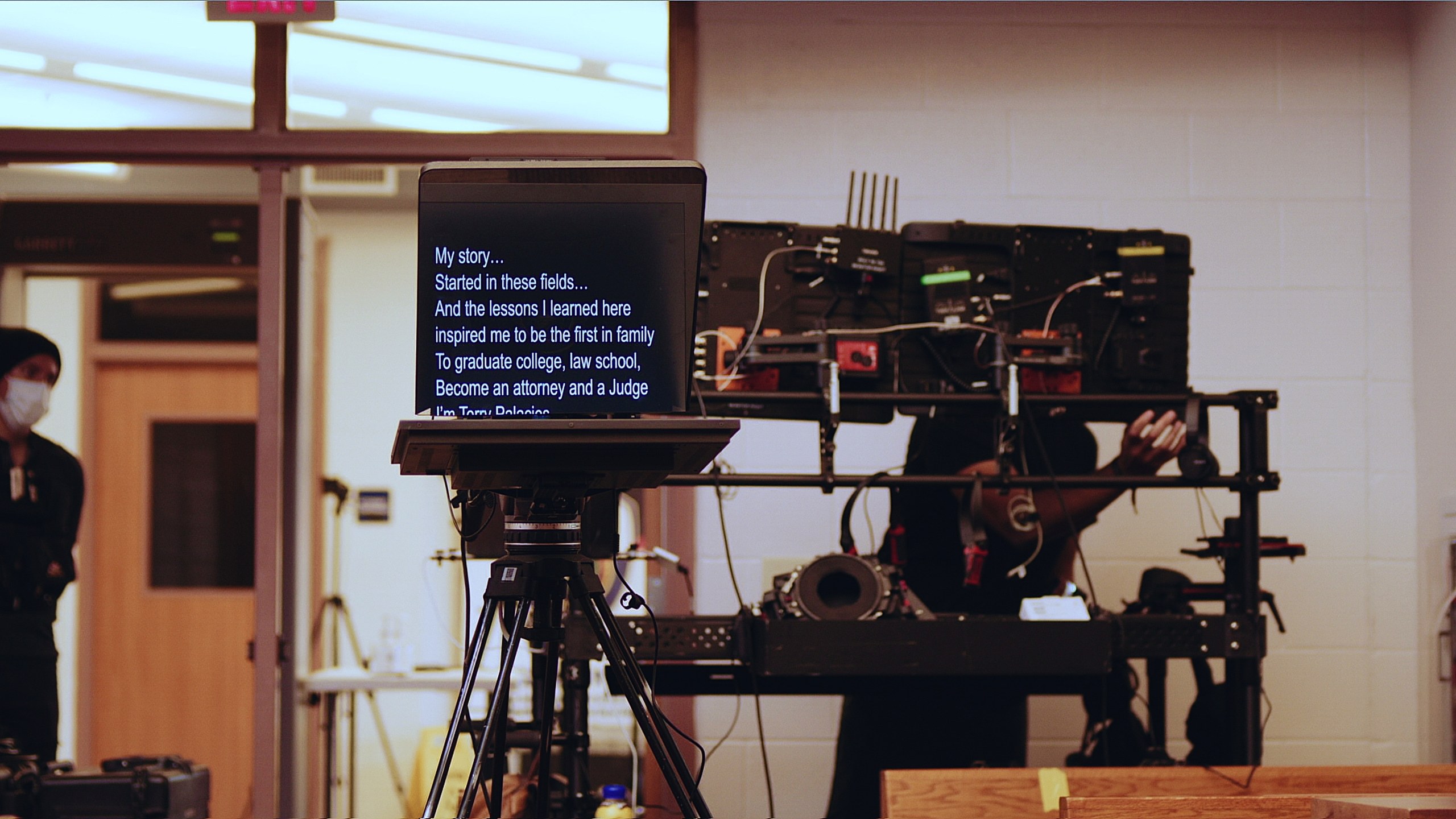 Gear 36 Teleprompter on a tripod in front of a cinema camera on a C&I Studios location set