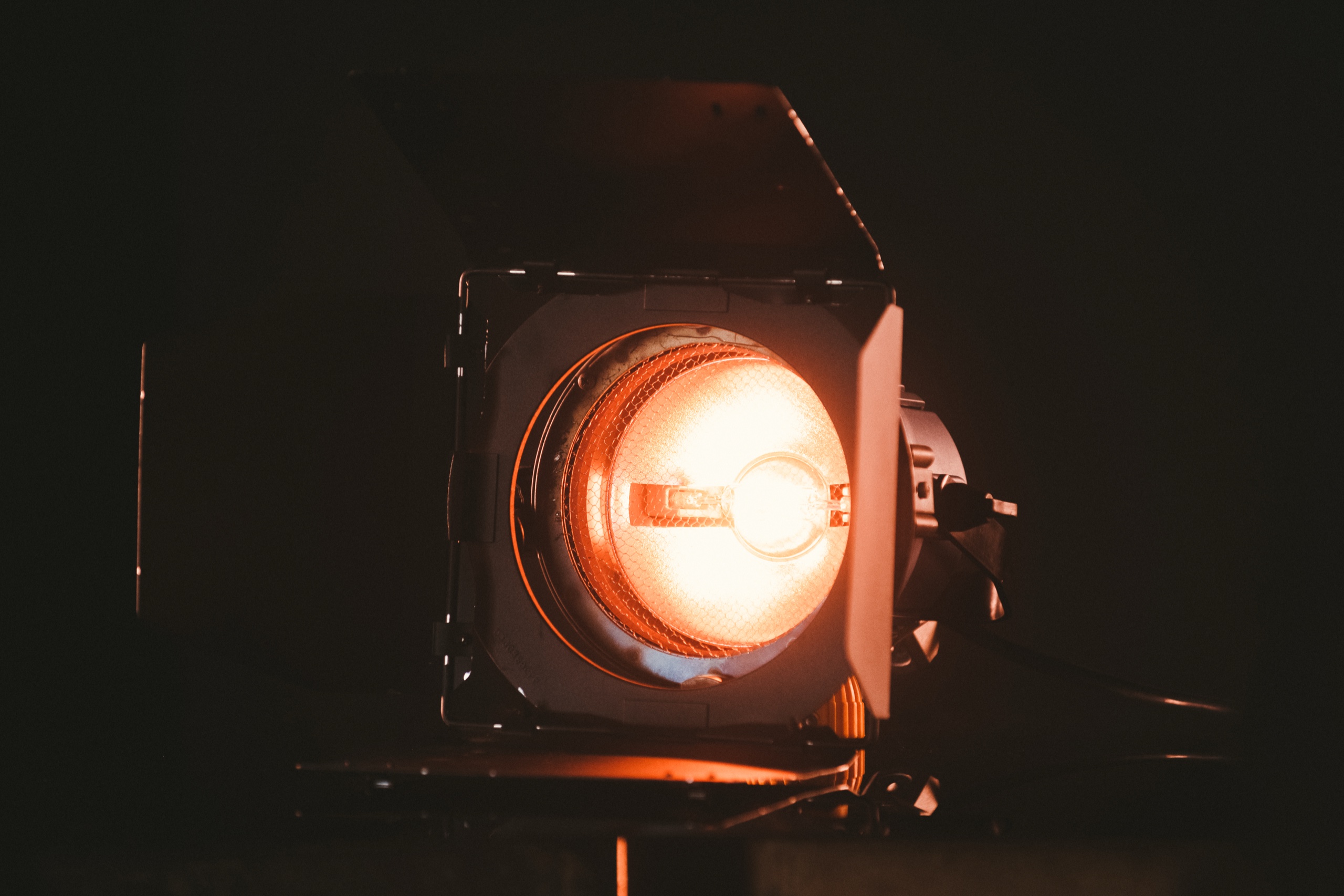 Lighting 8 Tungsten fresnel burning head on with barn doors from the C&I Studios lighting package