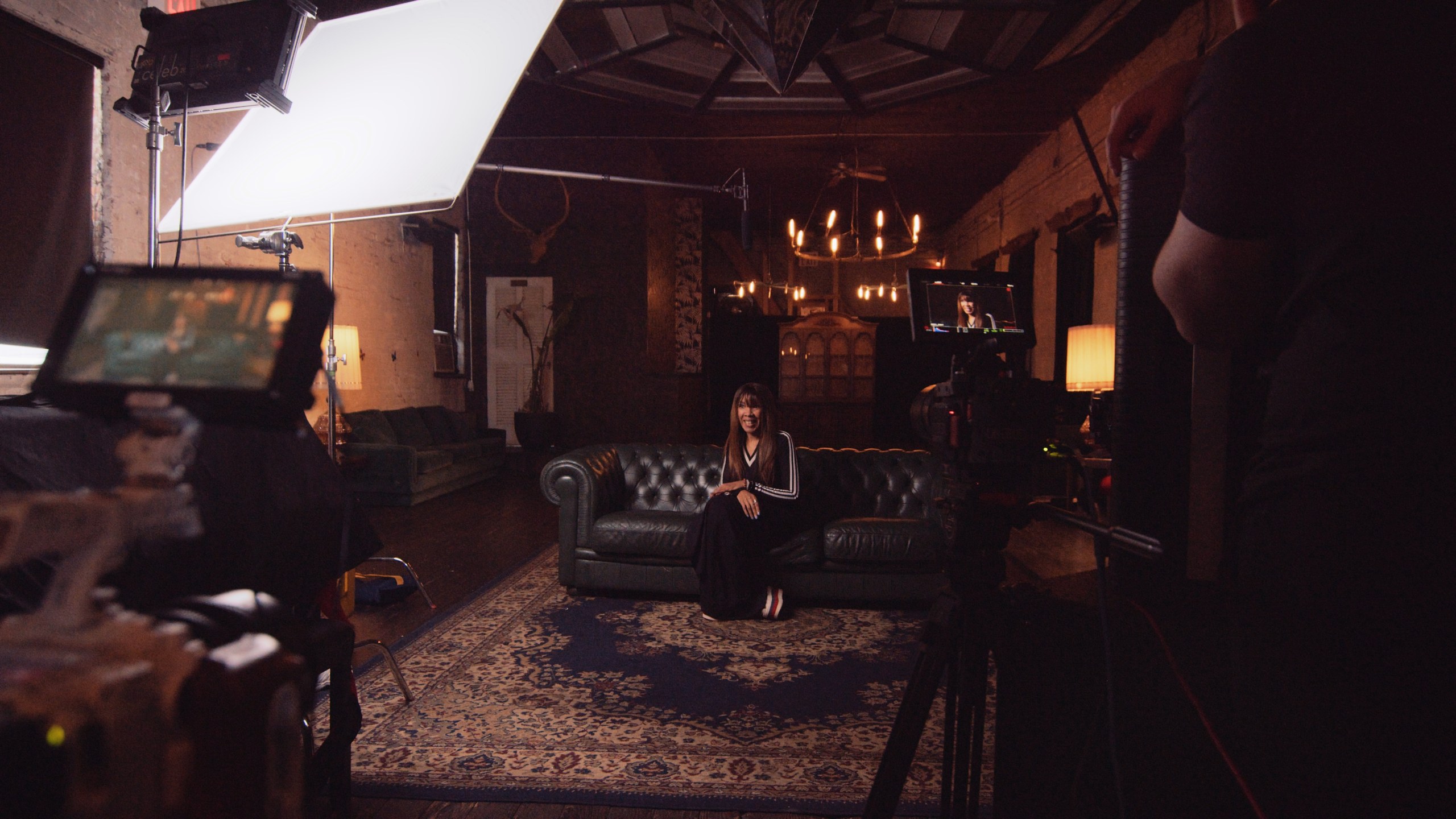 Lighting 16 Interview lit on location with a large soft source and the room practicals left in shot