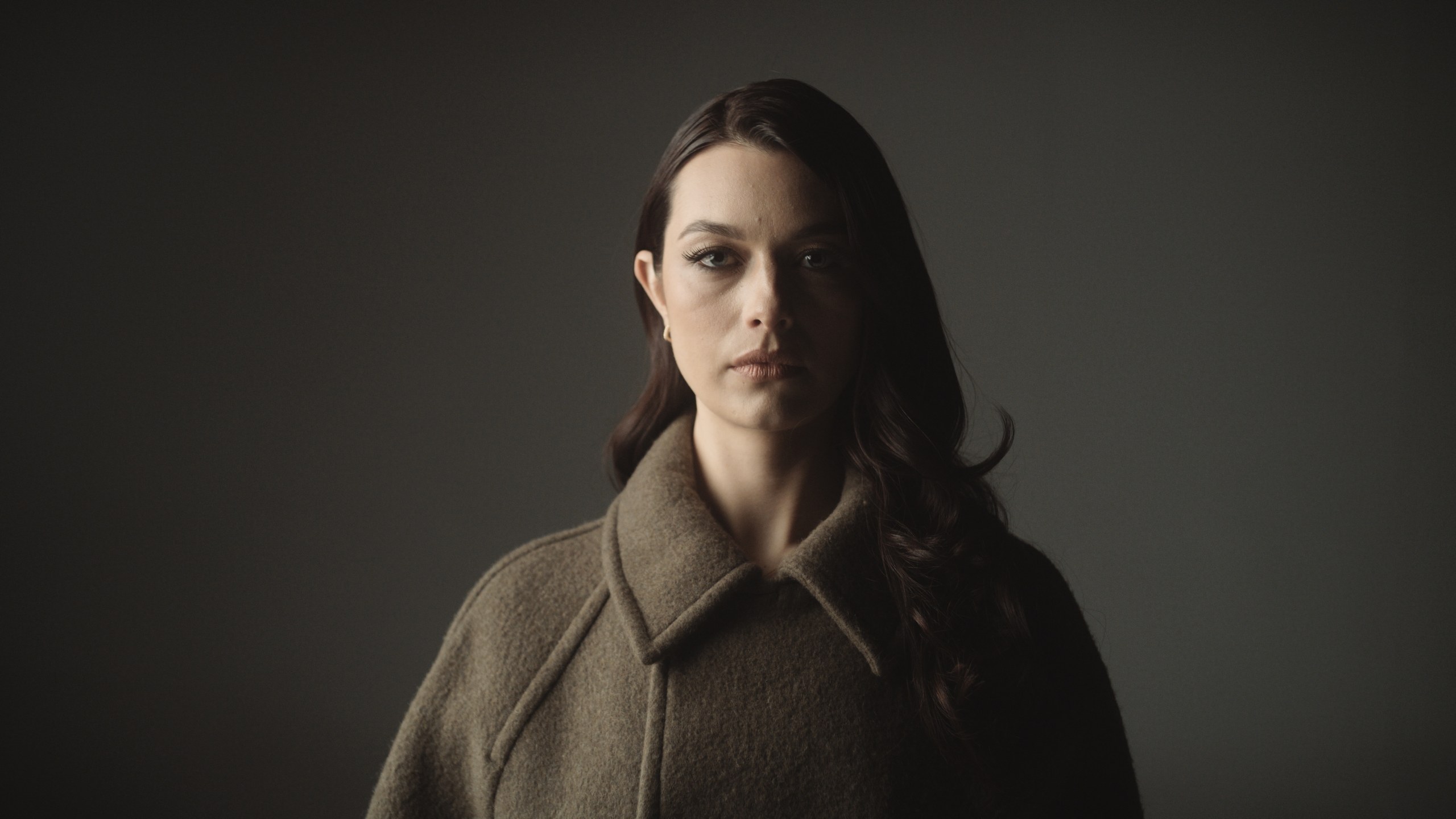 Lighting 6 Portrait lit low and soft with the background falling away behind her