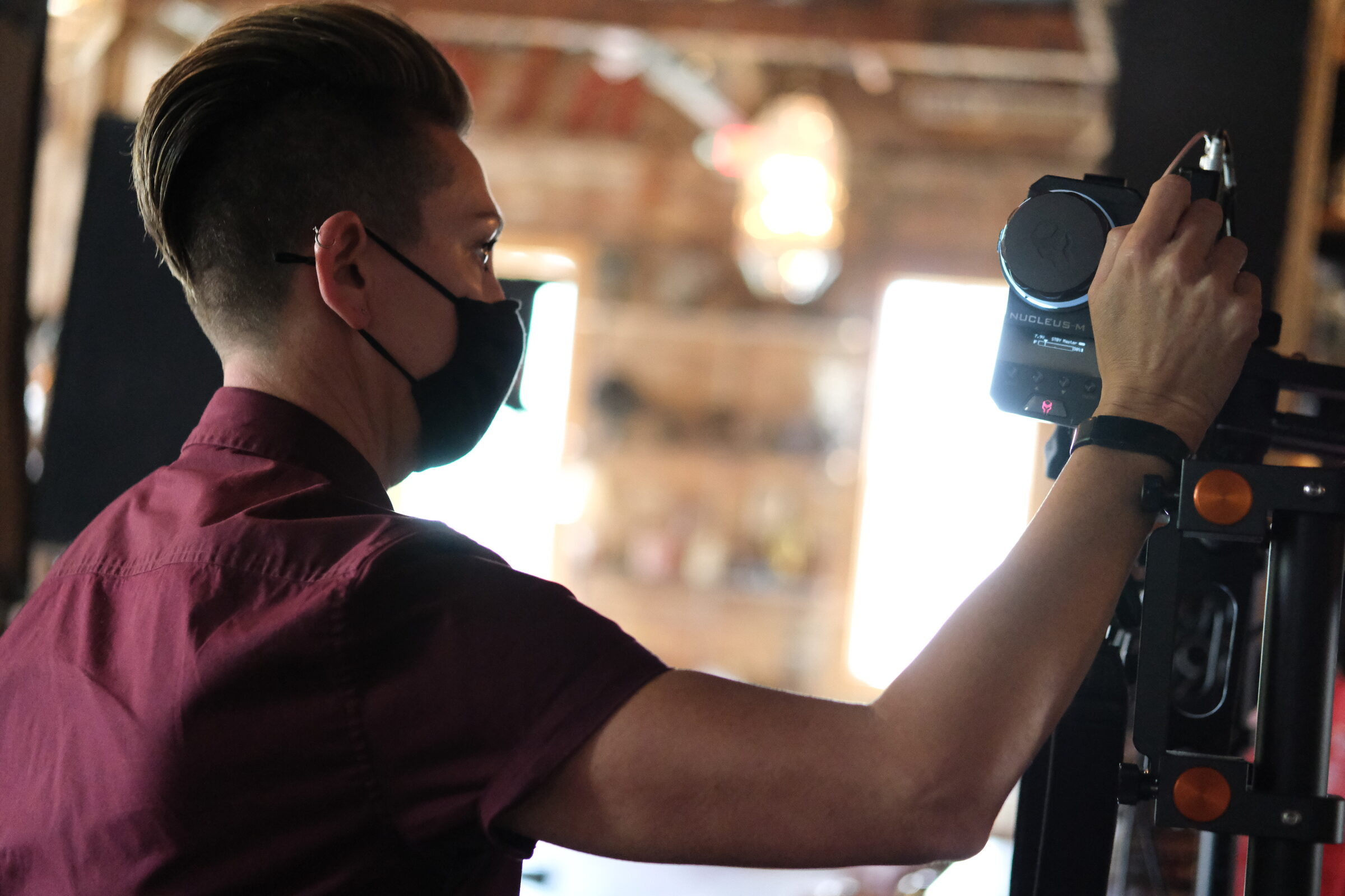 Fund Black Tech 15 Crew adjusting a light on the documentary set
