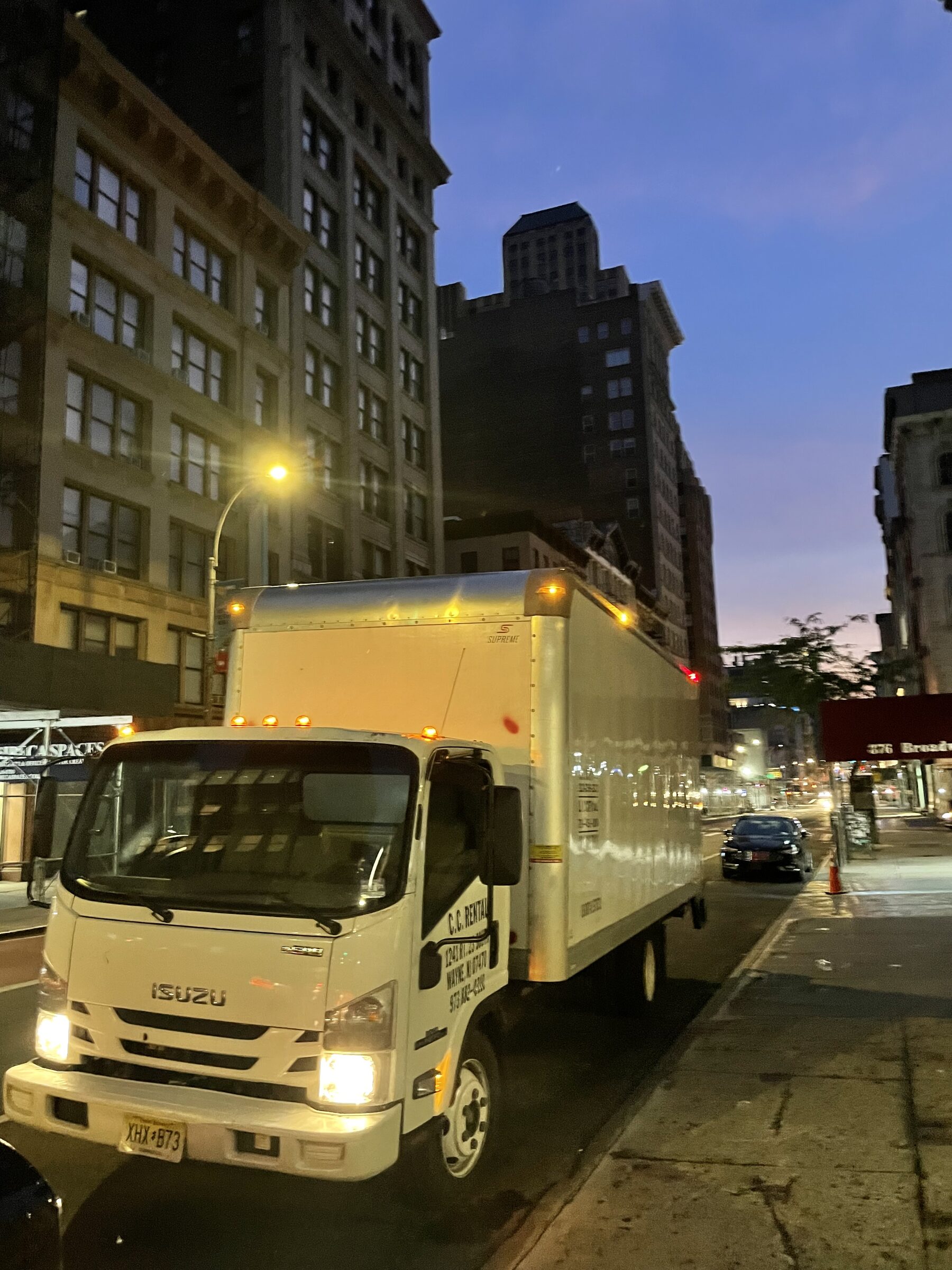Fund Black Tech 28 Production truck on a city street at dusk
