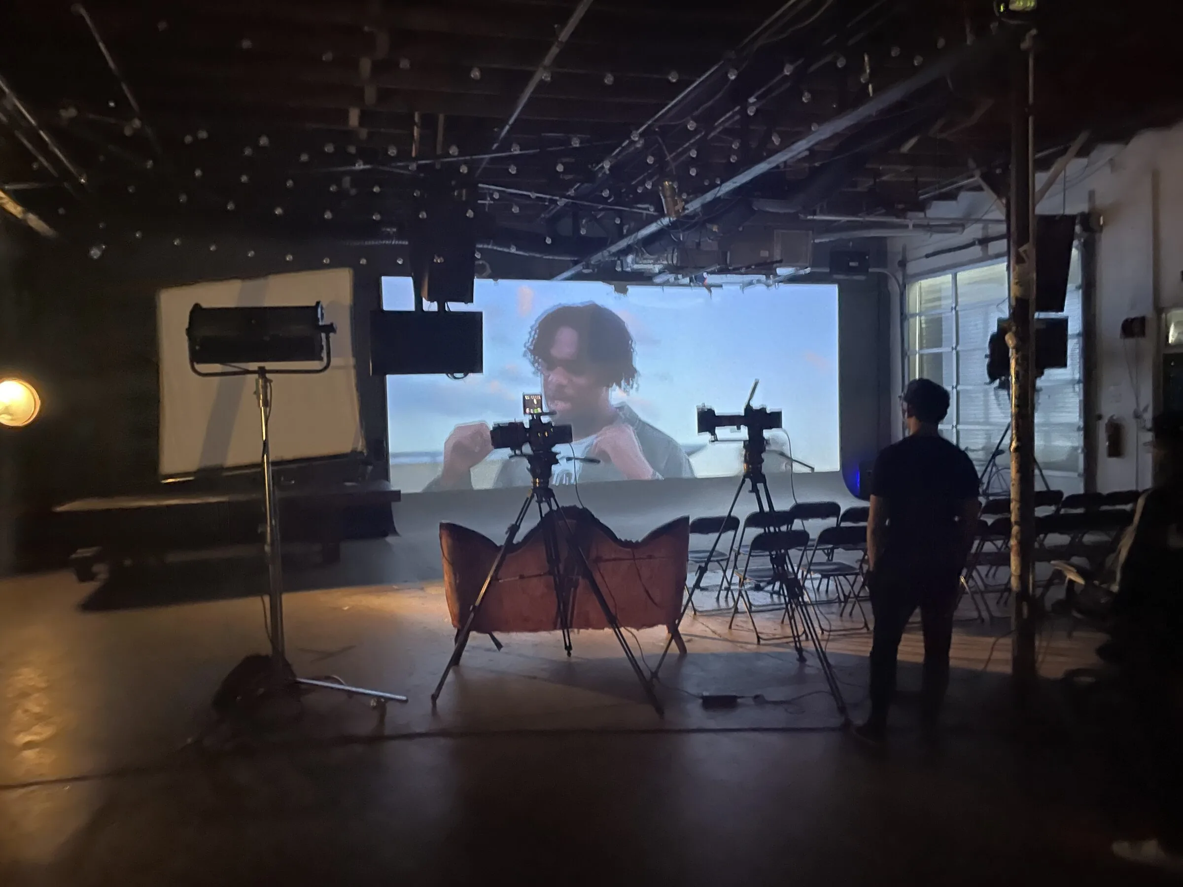 Fund Black Tech 45 Documentary footage projected on set