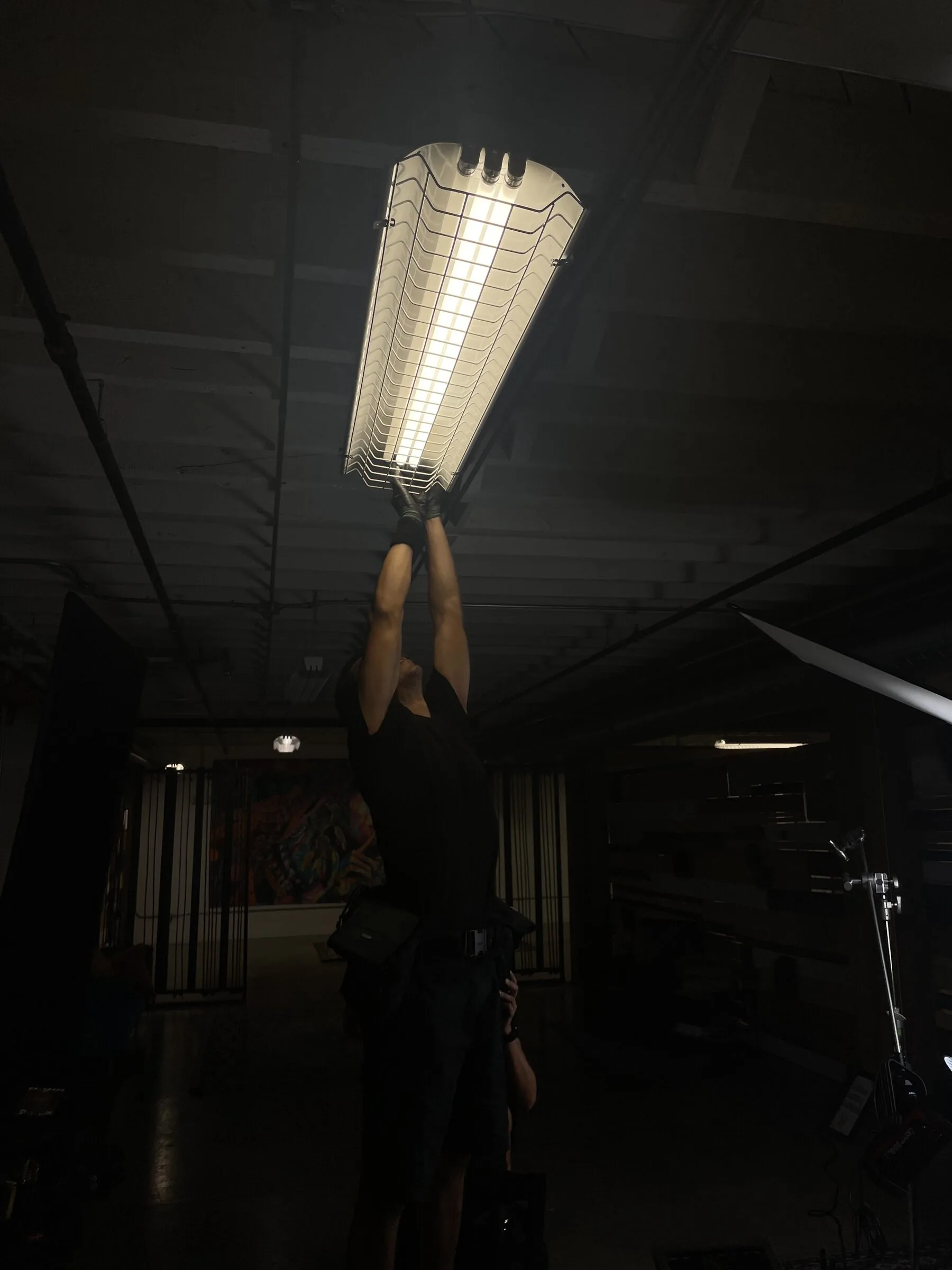 Fund Black Tech 44 Rigging an overhead light for a documentary interview