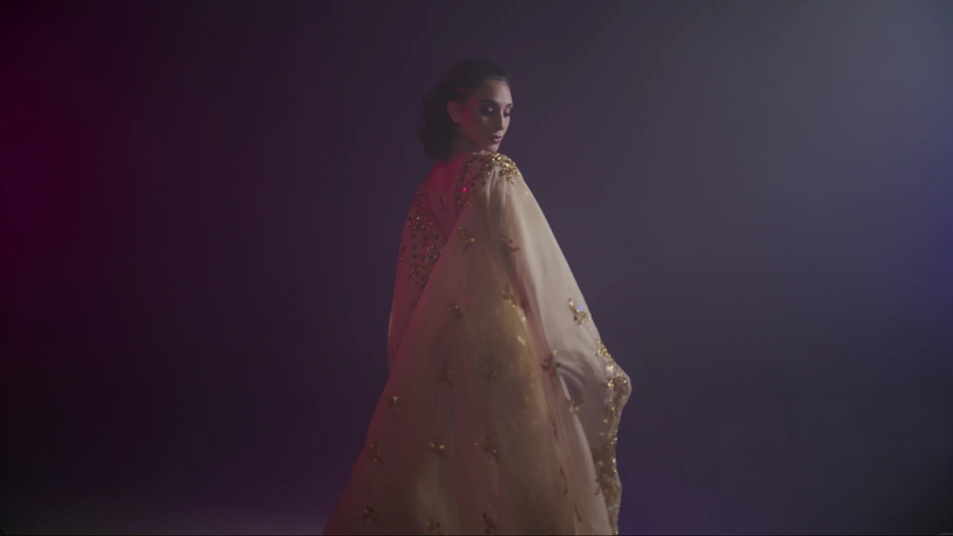 Dance video production dancer with a flowing veil under studio light