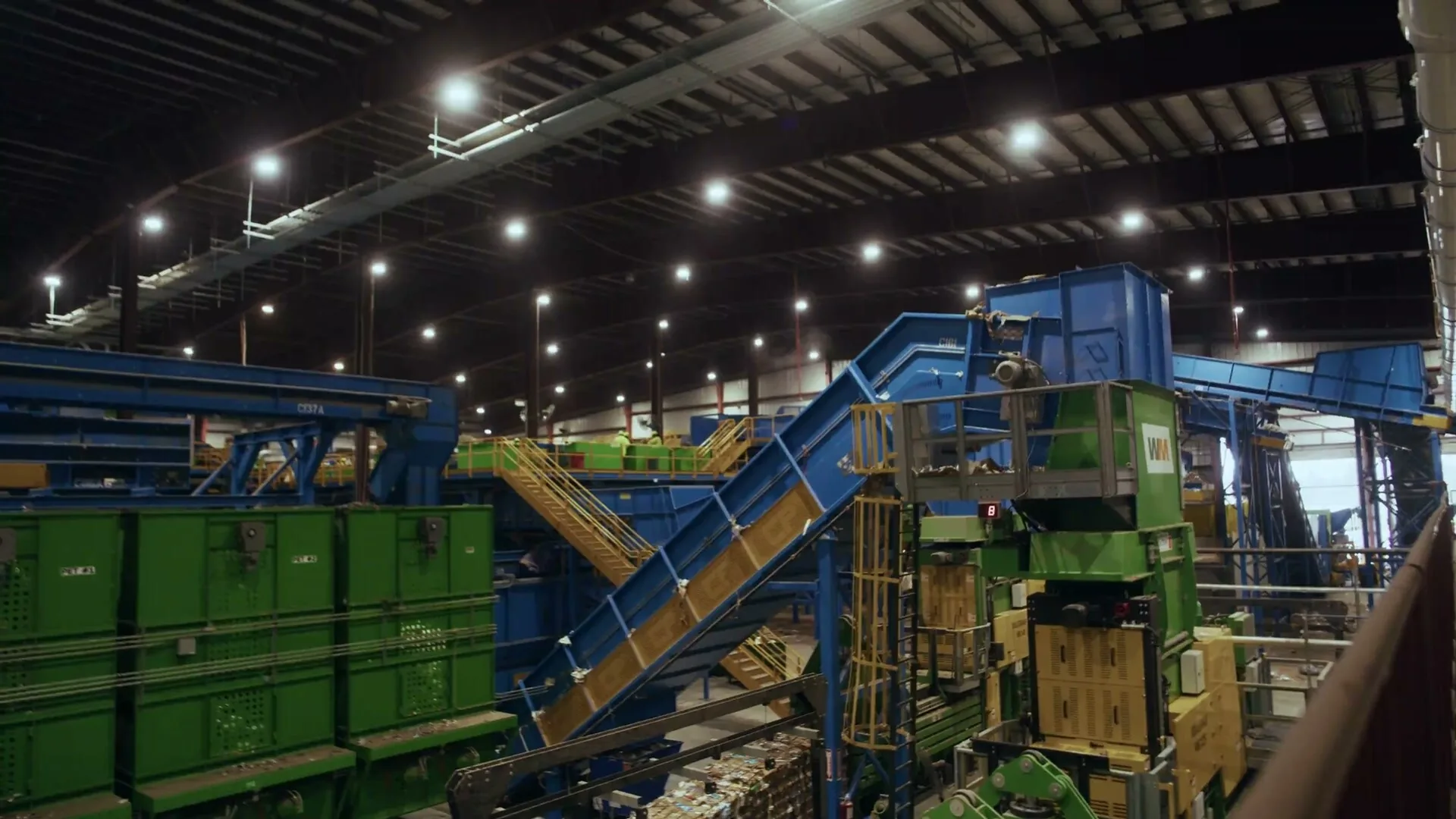 Conveyors and balers on the sorting floor of the Waste Management recycling facility in Pembroke Pines