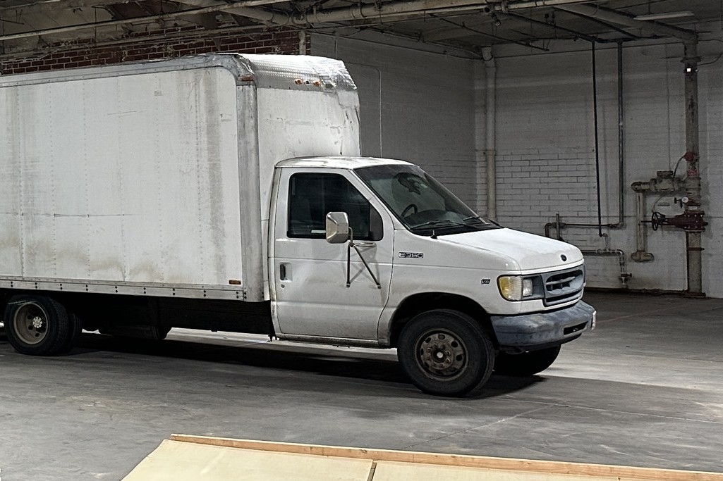 C&I Studios 3 ton Ford E-350 grip truck parked inside the studio