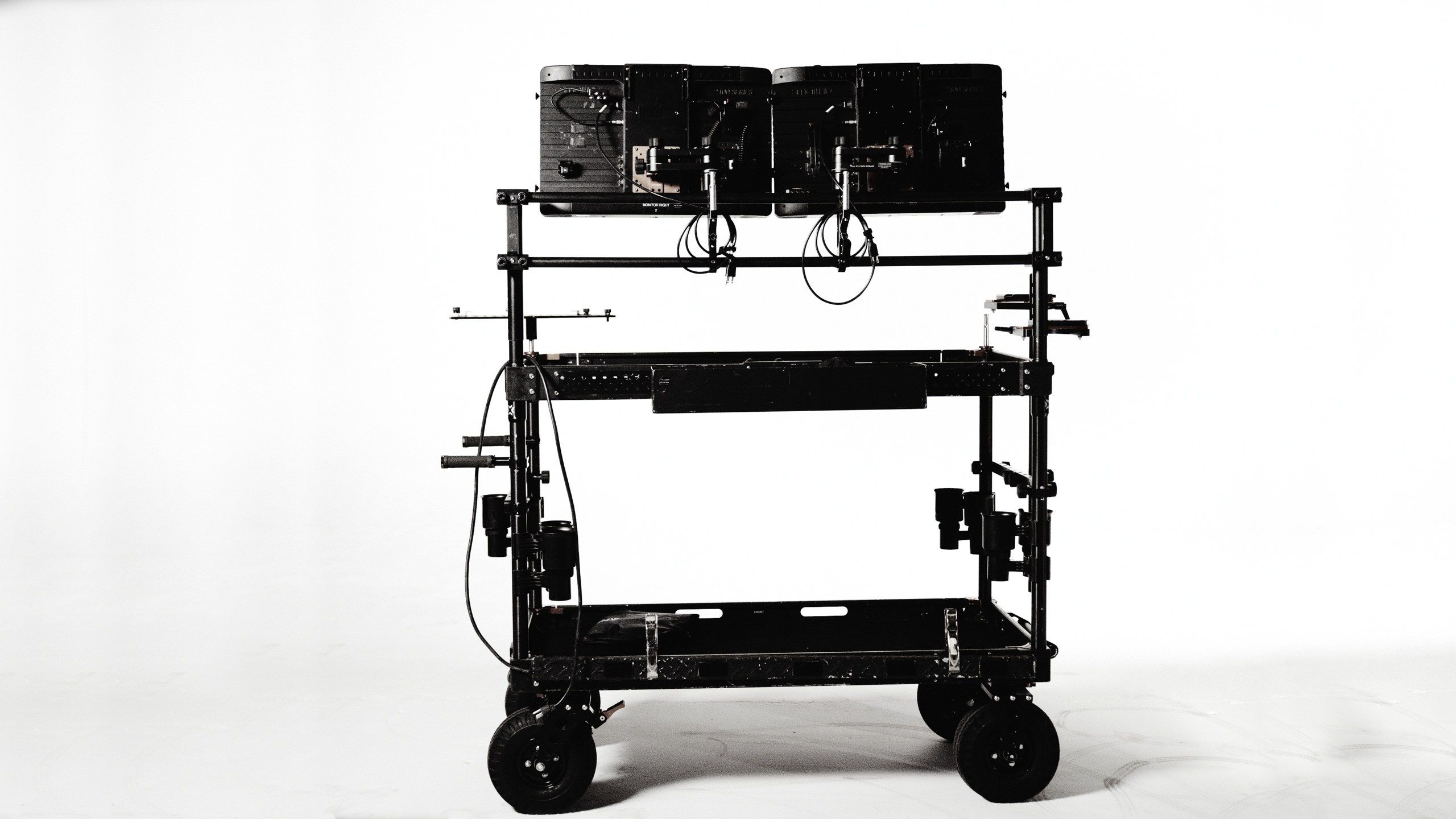 Production Gear 38 The Megatron, the C&I Studios rolling video village cart with two large monitors, on the white cyc
