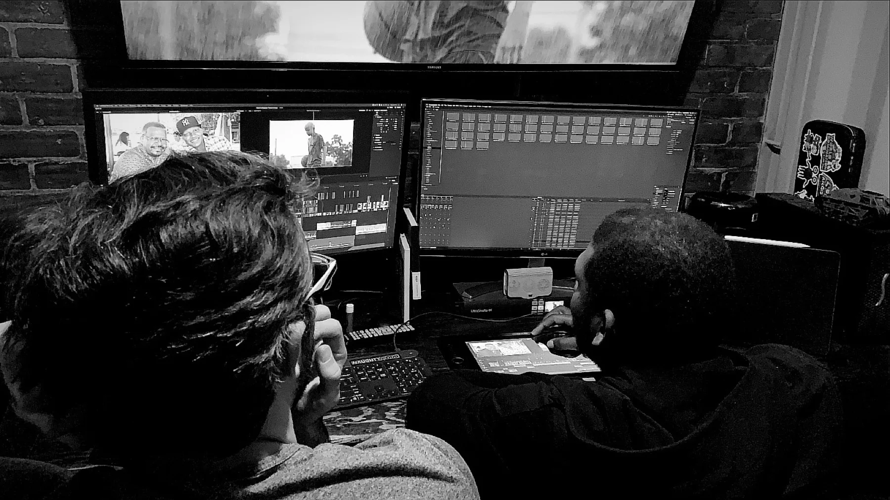 Post Production Services 7 Two editors reviewing a cut together in a C&I Studios edit bay