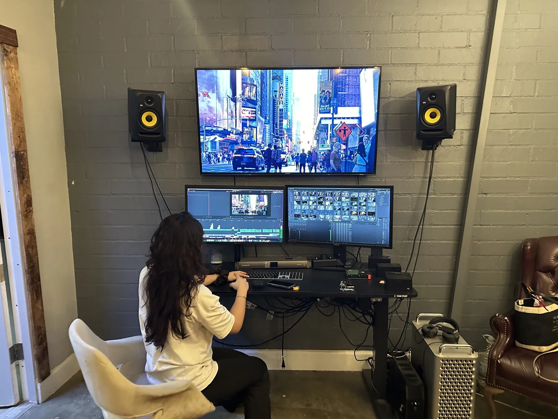 Post Production Services 8 Editor working at a timeline with a reference monitor in a C&I Studios edit bay