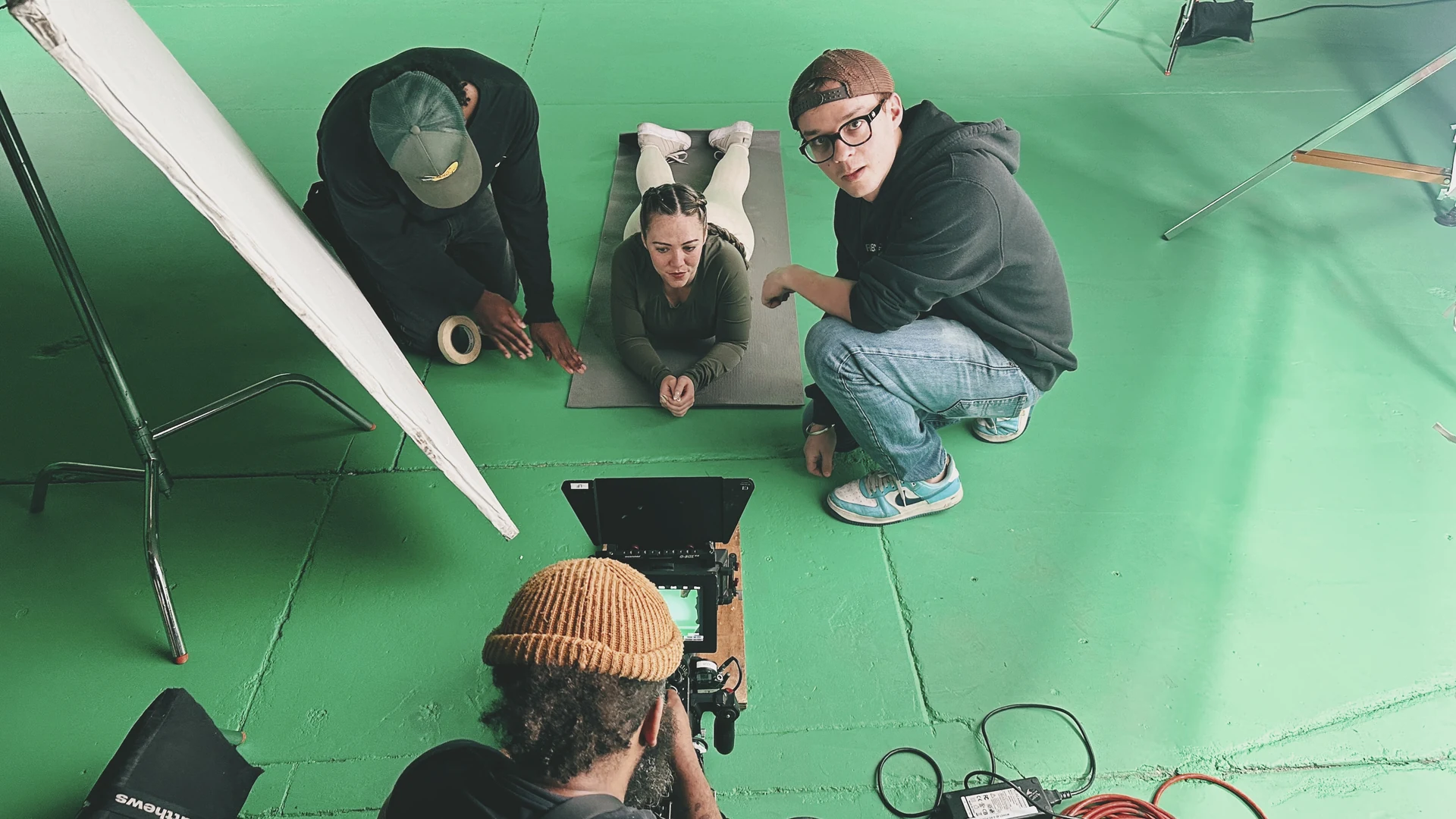 Thundr 2 C&I Studios crew reviewing the storyboard on the green screen stage for the Thundr shoot