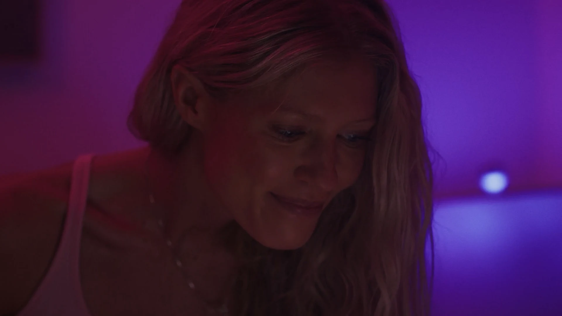 Thundr 9 Close on the main talent lit in purple in the Thundr commercial