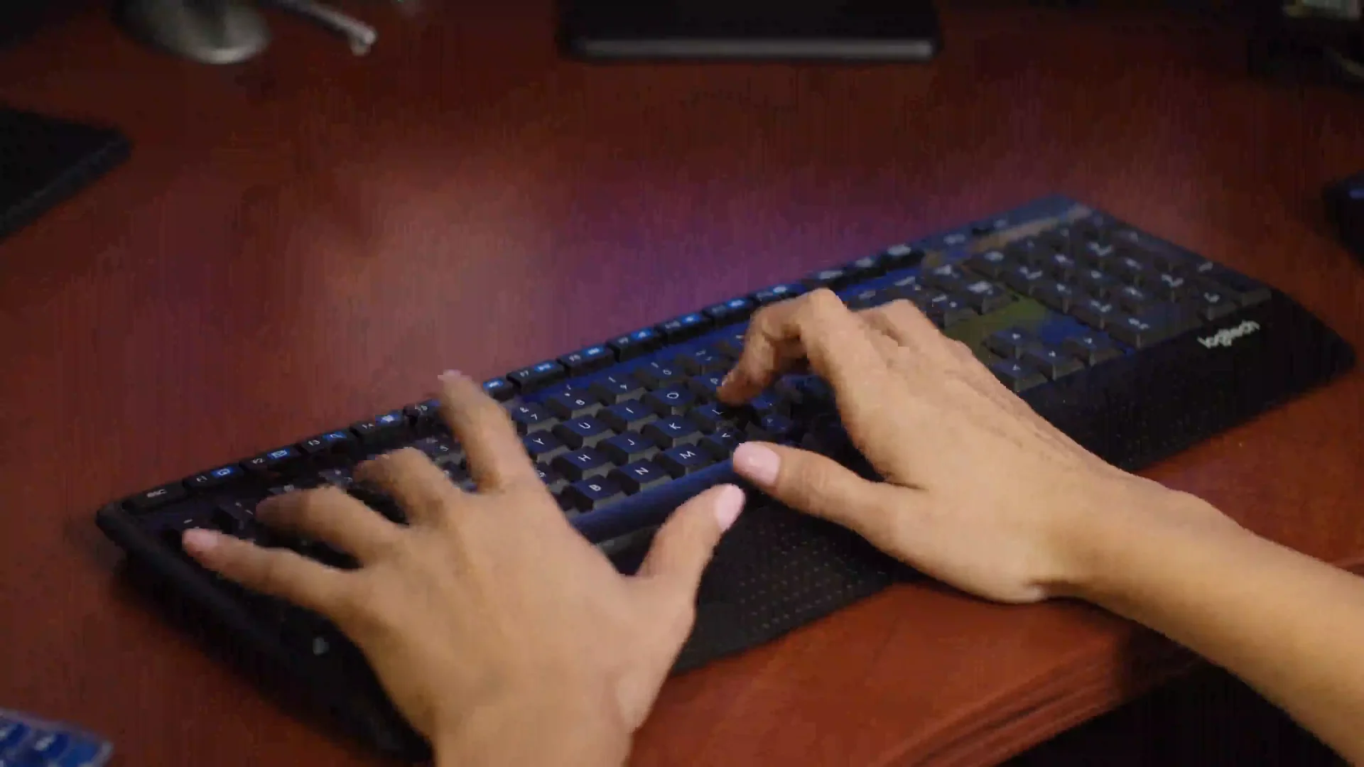 Commercial Medical Escorts 7 Hands typing on a keyboard at the Commercial Medical Escorts office